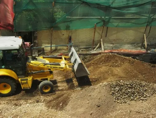 Perimeter barrier on a construction site for dust and sediment control